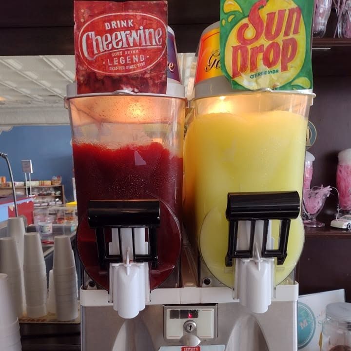 Slush machine spinning Cheerwine and Sun Drop at The Candy Shoppe on Main
