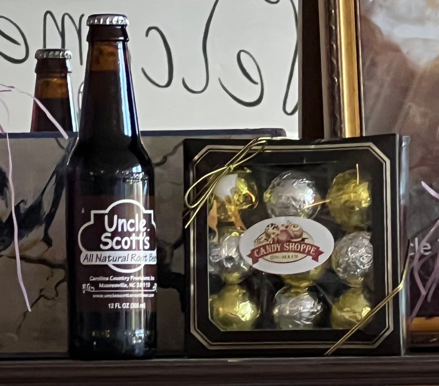 Gift box of chocolates beside a glass bottle soda at The Candy Shoppe on Main