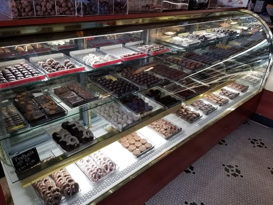 Glass case filled with chocolates inside The Candy Shoppe on Main