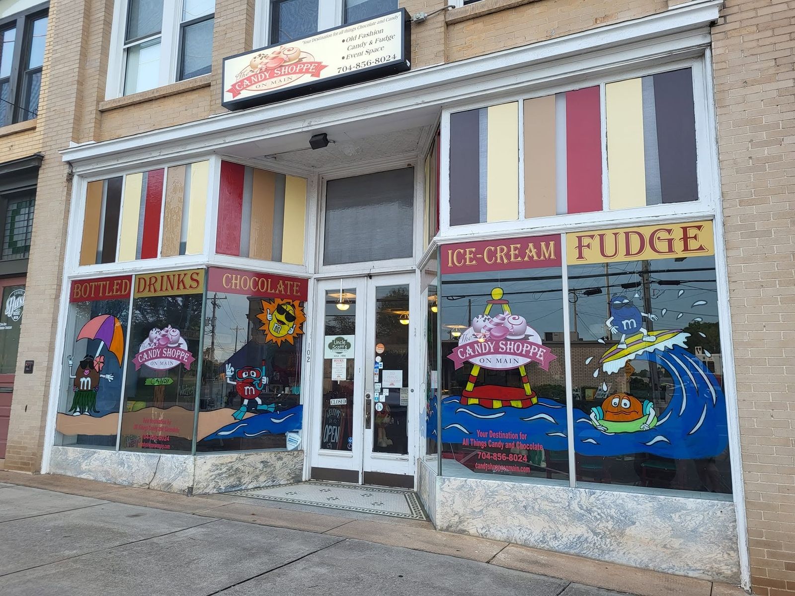 The full storefront of The Candy Shoppe on Main seen from across the street