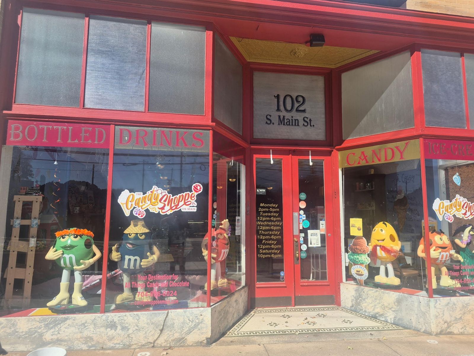 The red storefront of The Candy Shoppe on Main at 102 S Main St
