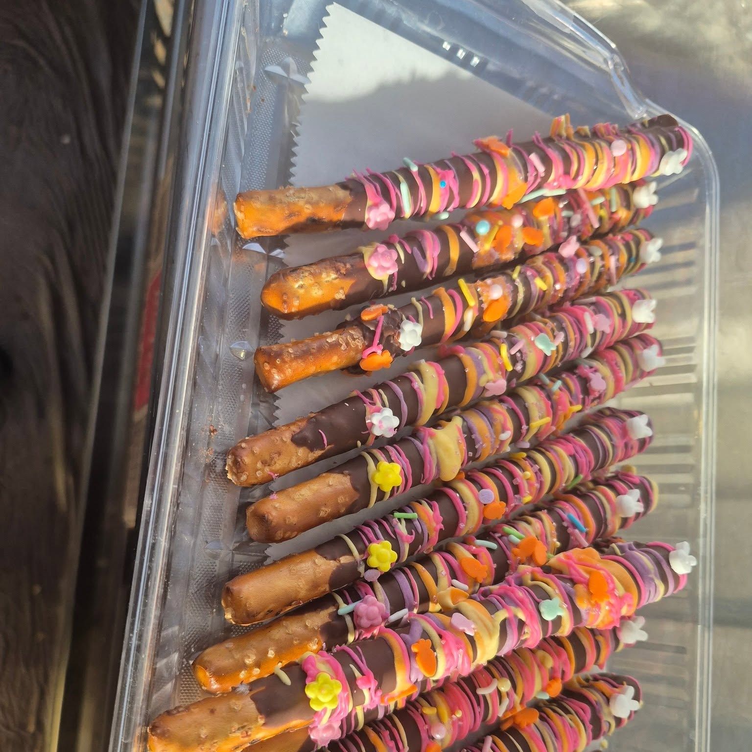 Chocolate-dipped pretzel rods drizzled with icing at The Candy Shoppe on Main