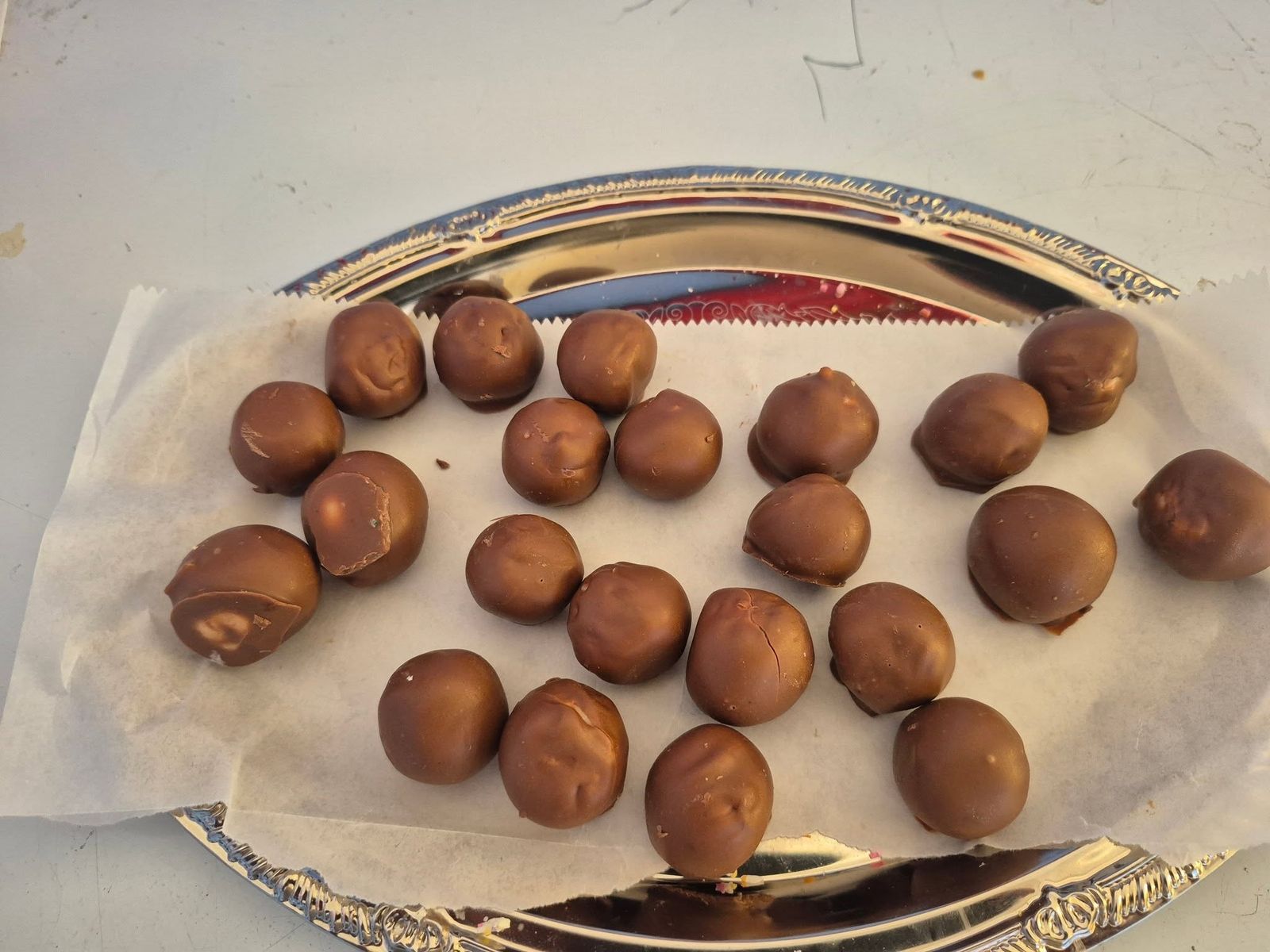 Chocolate truffle balls on parchment at The Candy Shoppe on Main