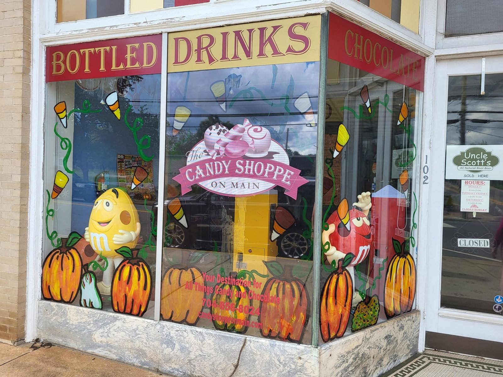 The Bottled Drinks window at The Candy Shoppe on Main storefront