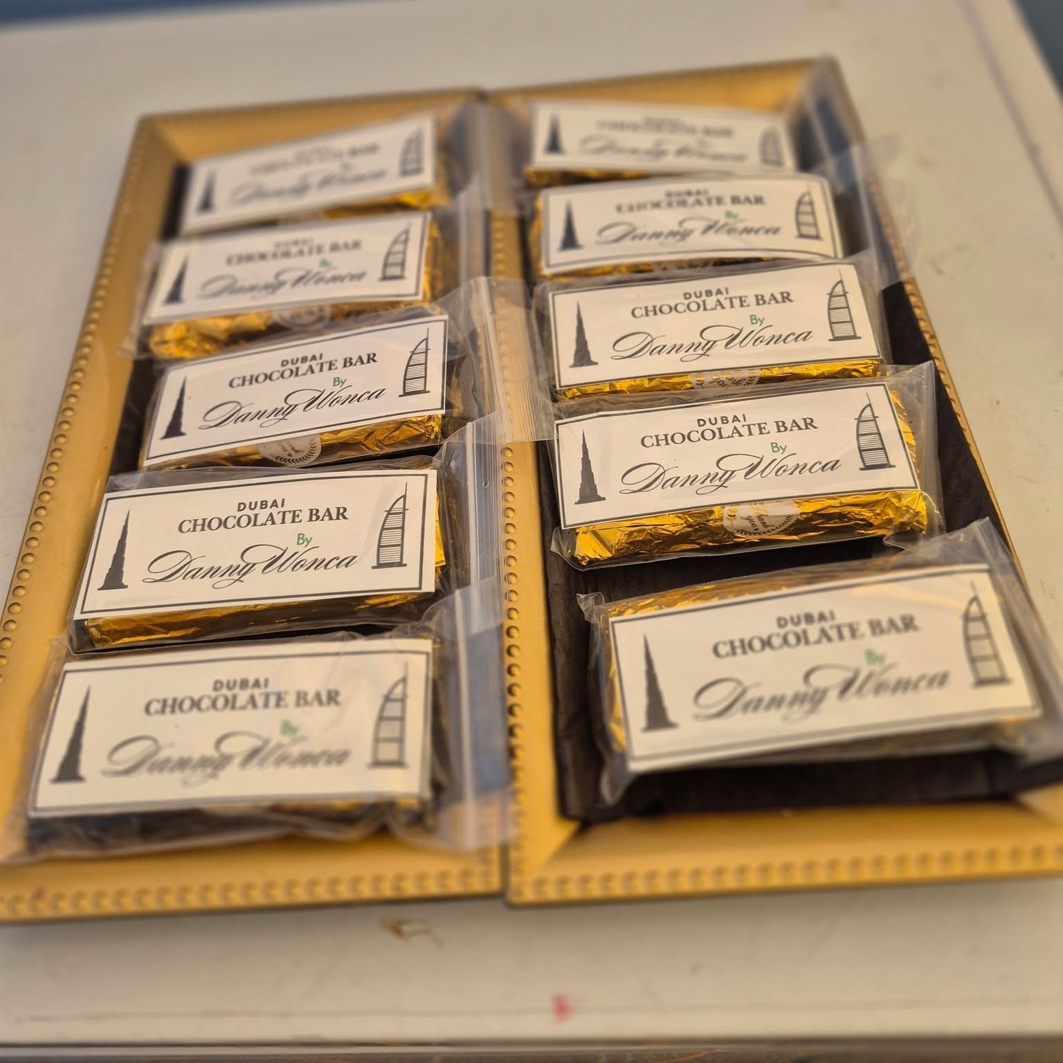 Dubai chocolate bars wrapped in gold foil at The Candy Shoppe on Main