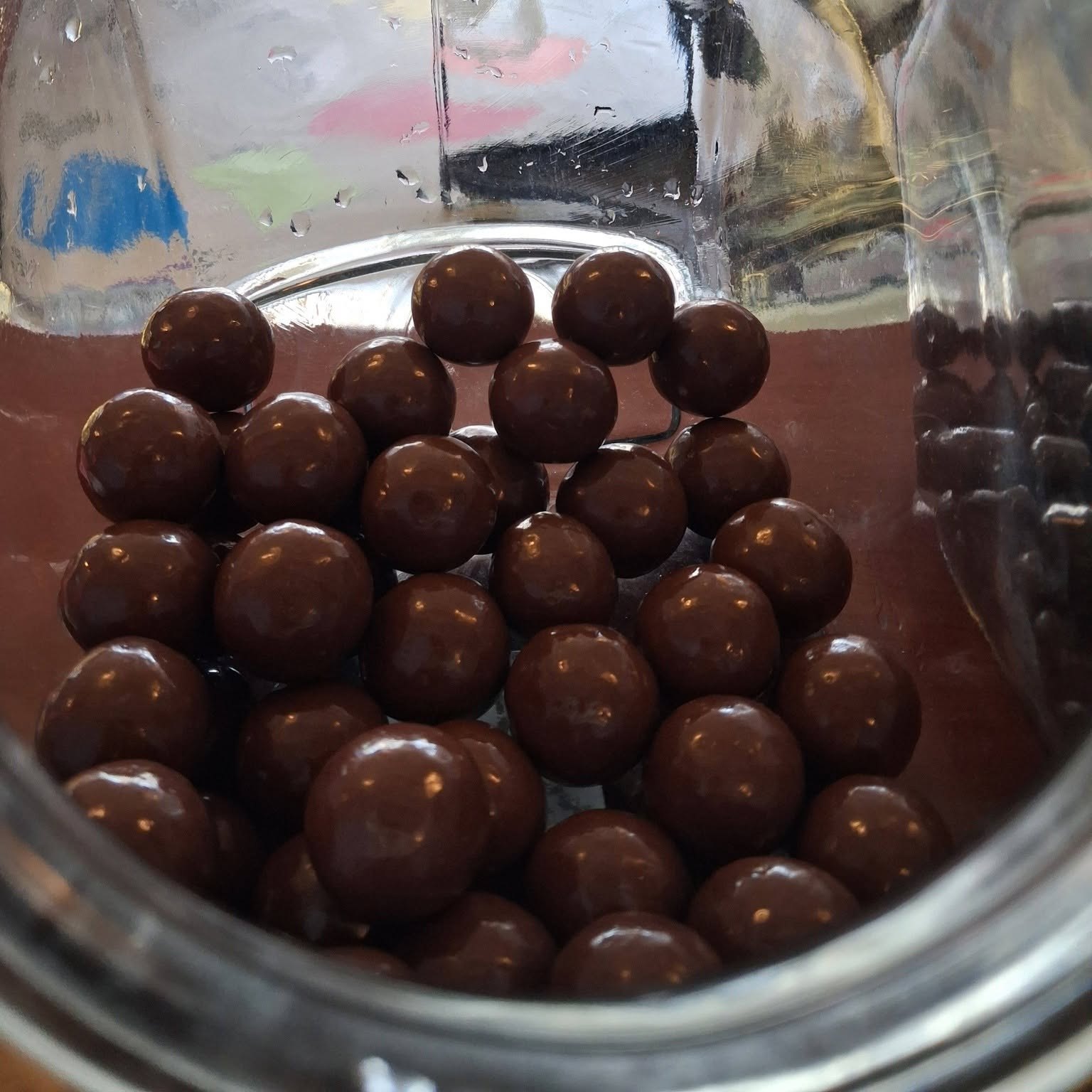 Jar of chocolate malt balls at The Candy Shoppe on Main