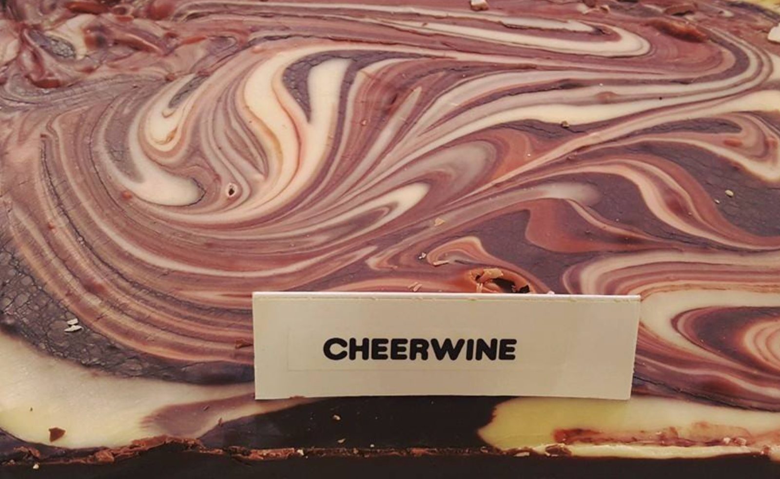 Swirled Cheerwine fudge slab with its printed label at The Candy Shoppe on Main