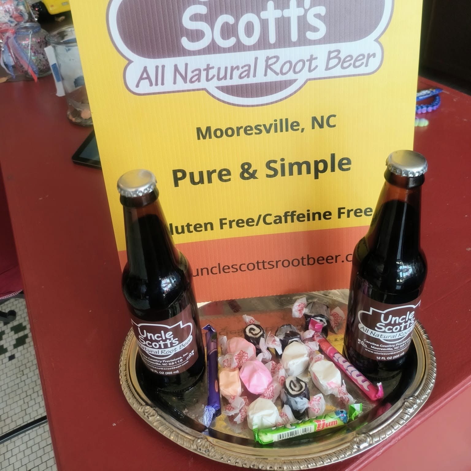 Uncle Scott's Root Beer bottles and display sign at The Candy Shoppe on Main